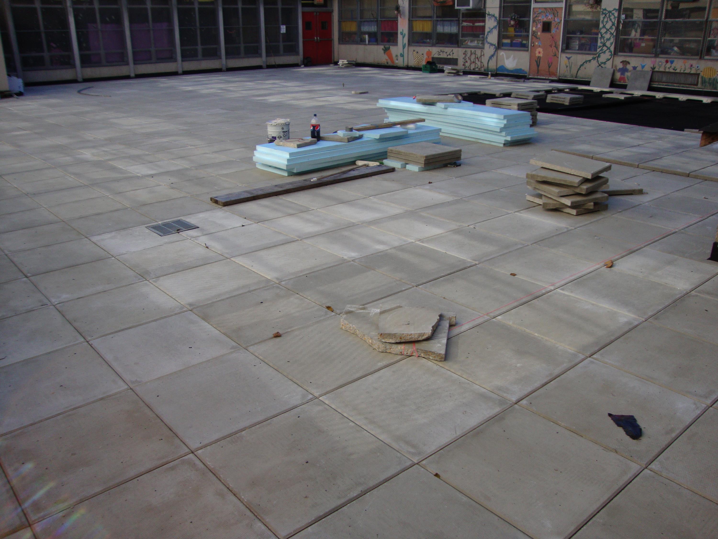 Public School Recreational Rooftop Playground Area Over Concrete Pavers a