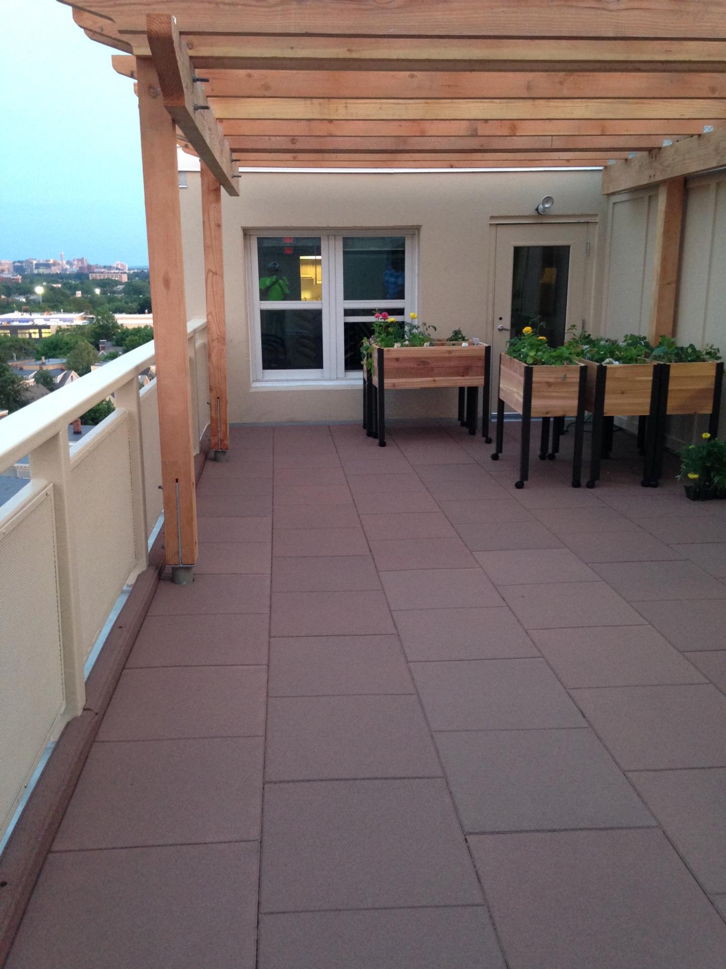 Boarder-Guards along the edge of this rubber paver patio Unity pavers on rooftop with Boarder-Guards along edge