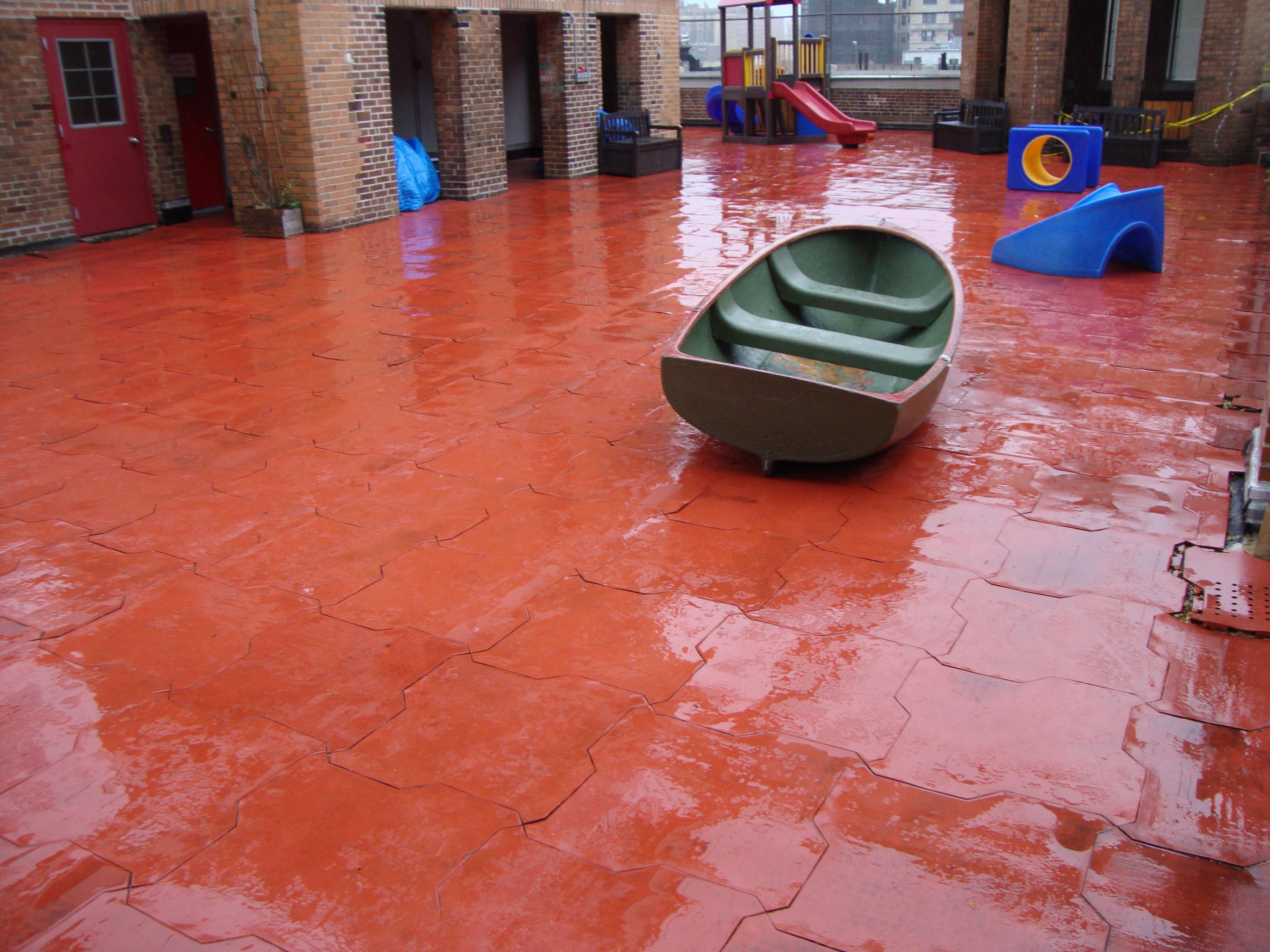 Rooftop Playground in need of a permeable rubber play tile c