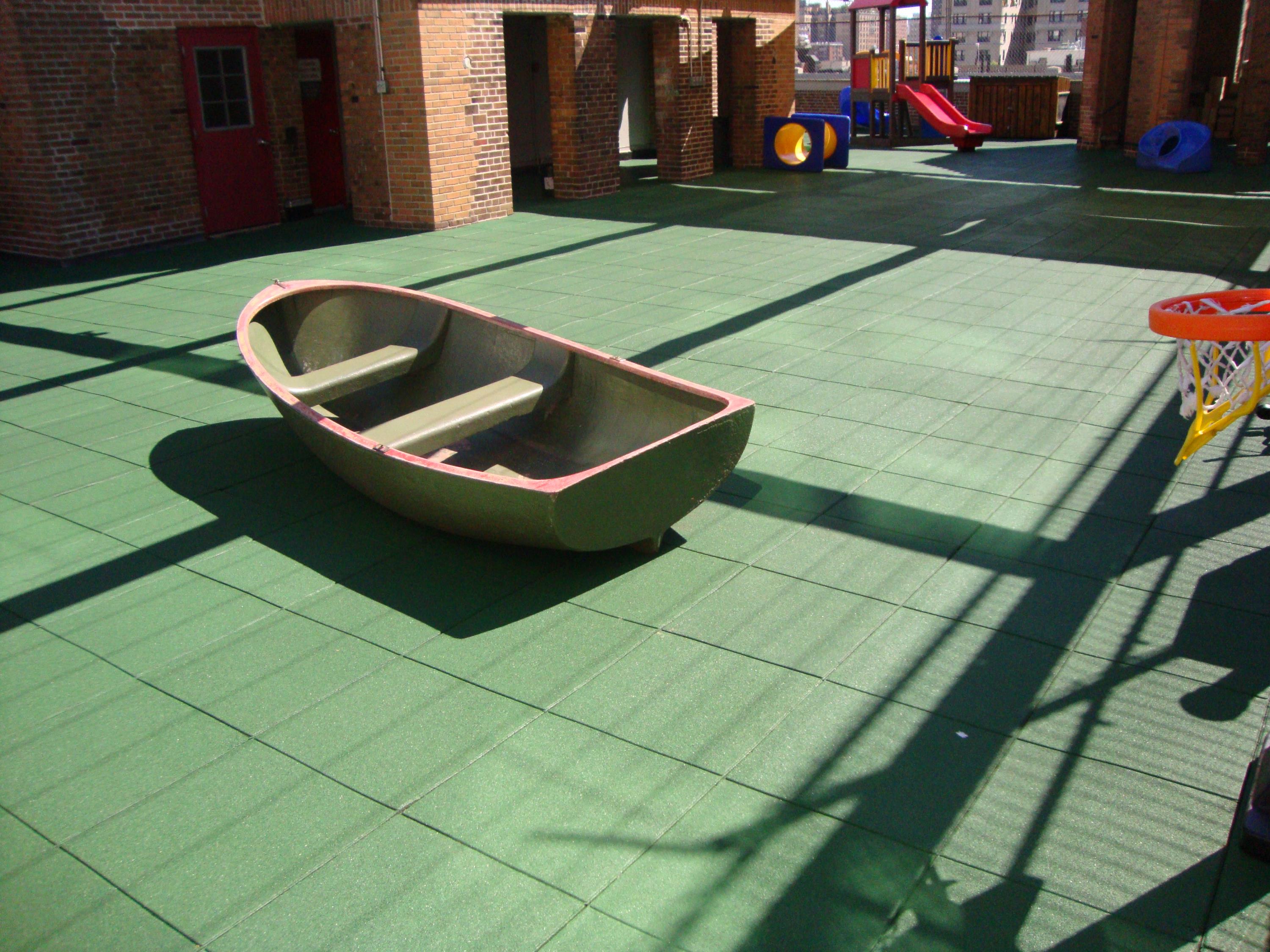 Rooftop Playground in need of a permeable rubber play tile d