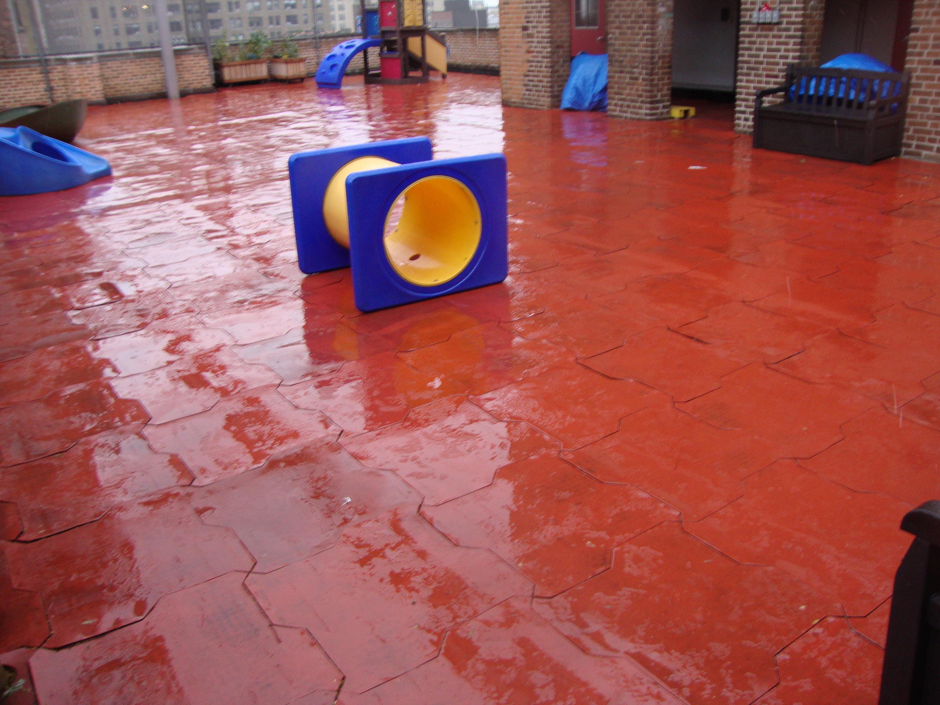 Rooftop Playground in need of a permeable rubber play tile d