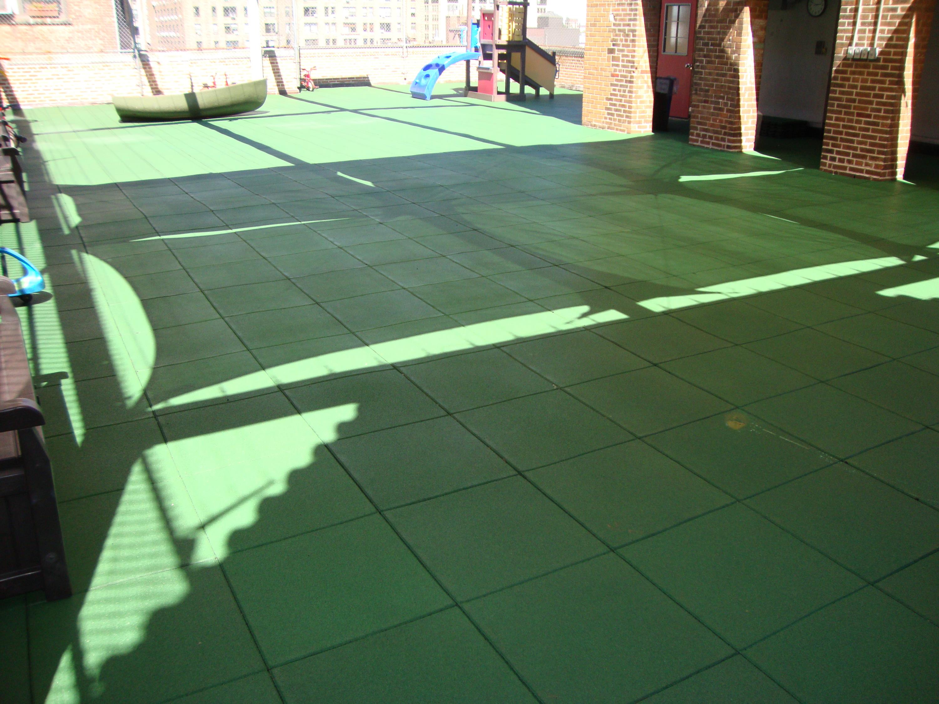 Rooftop Playground in need of a permeable rubber play tile f