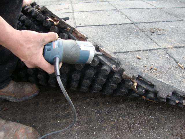 Repair & Maintenance Showing a rotozip cleaning the interlocks of glue