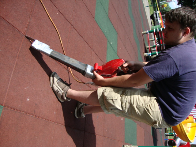 UNITY - cleaning the seams with a putty-knife taped to the end of a blower