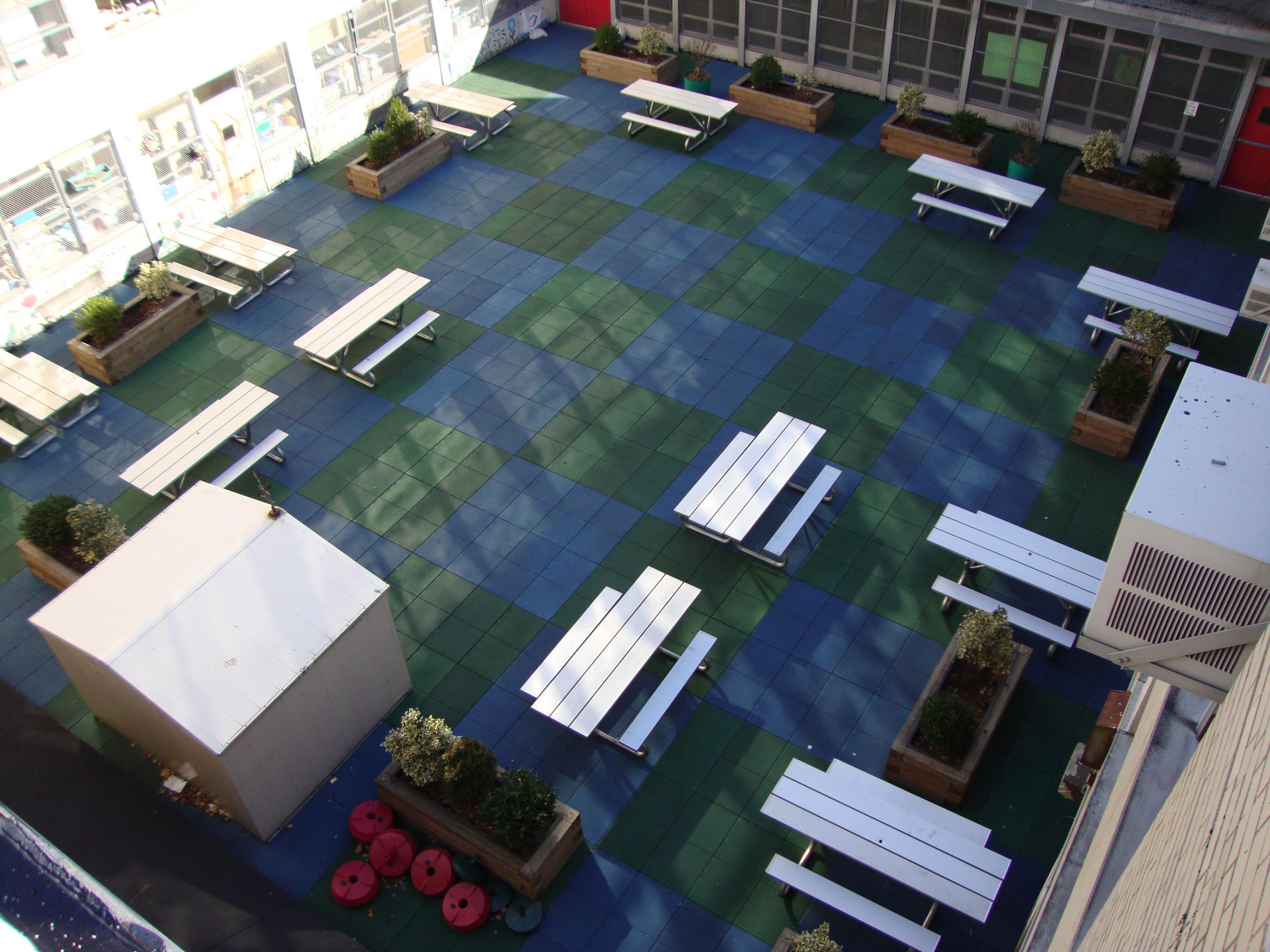 Public School Recreational Rooftop Playground Area Over Concrete Pavers