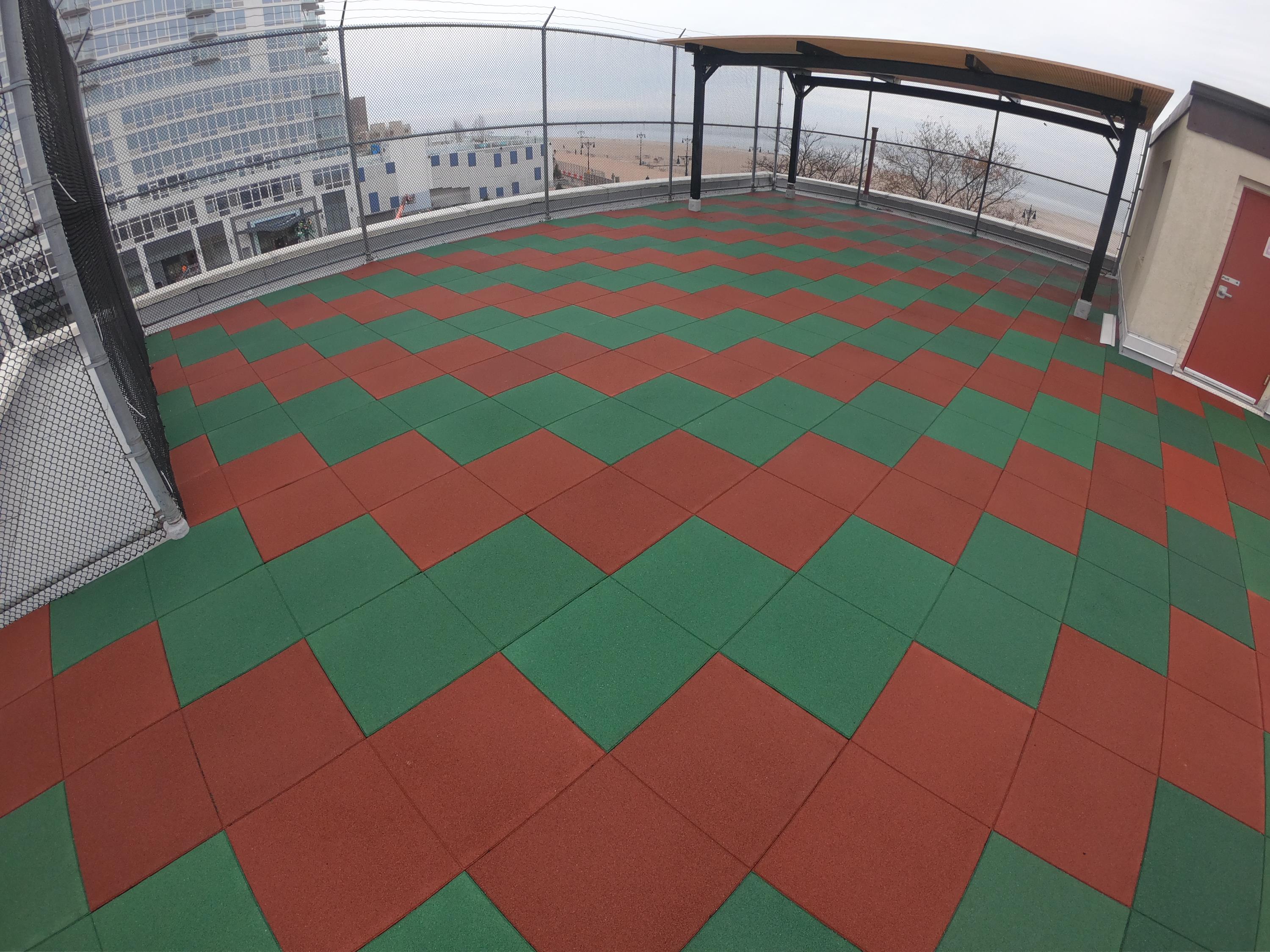 UNITY Surfacing - Rubber Playground Tiles on Rooftop w/Designs