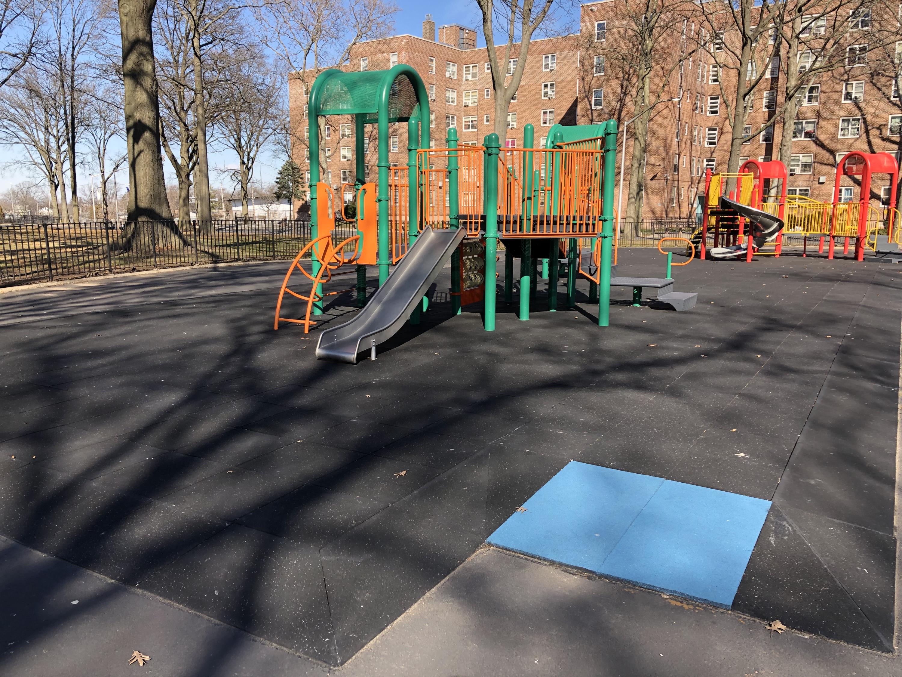 UNITY Safety Surfacing Showing Blue ADA Accessible Transitional Ramp for Playgrounds