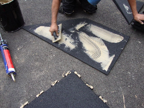 Gluing the underside of the transitional ramp edge to solid sub-base