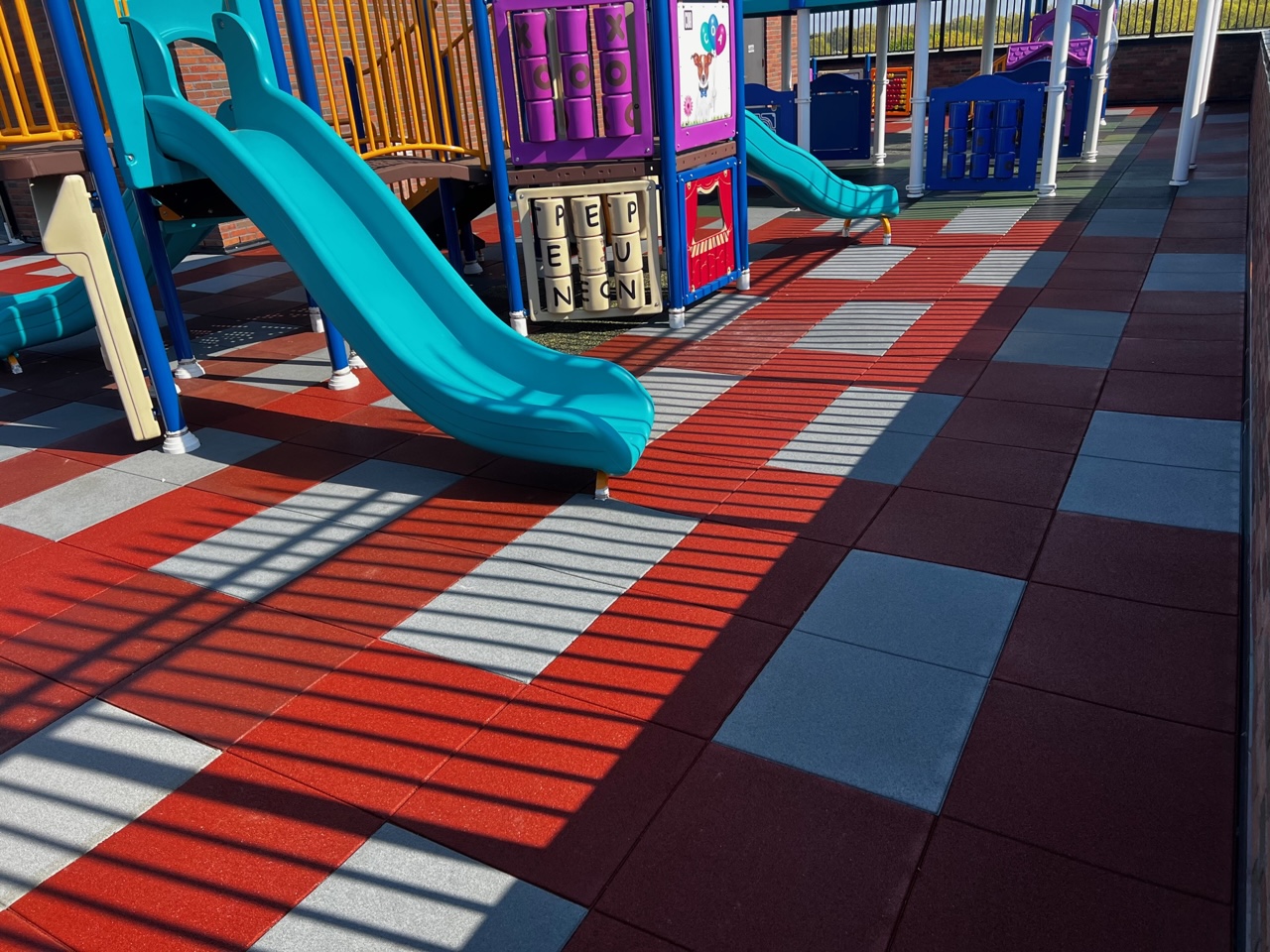 Charter School Rooftop Playground Using Bright Pigmented Colors