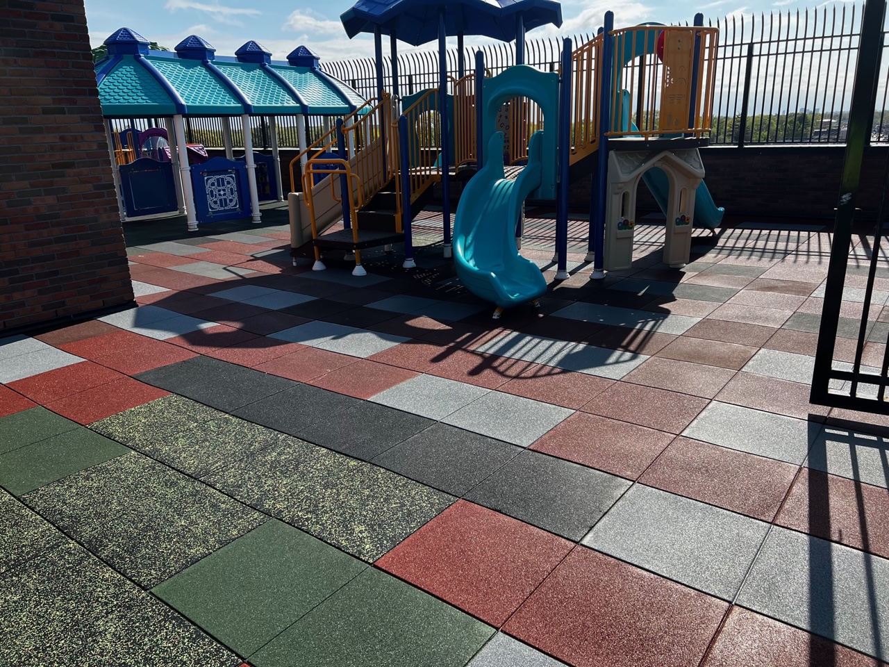 Charter School Rooftop Playground Using Bright Pigmented Colors