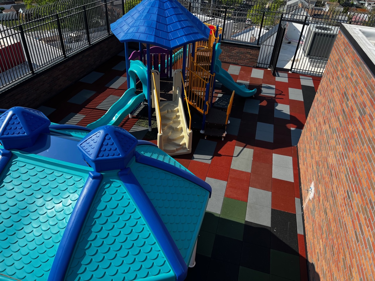 Charter School Rooftop Playground Using Bright Pigmented Colors