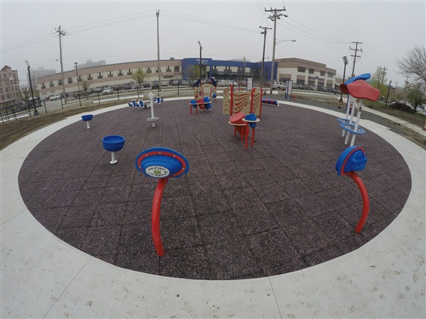 Circle Playground Project that is counter-sunk using Splash Design Tiles