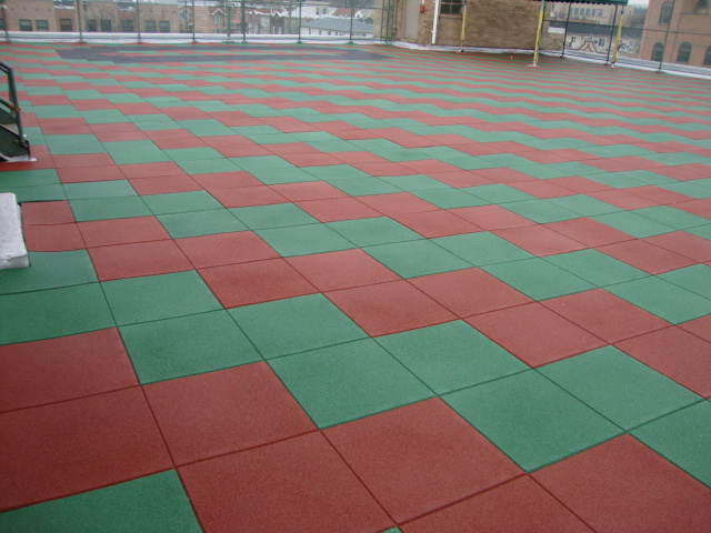 Pigmented Green and Red rubber pavers on the rooftop of this Assisted Living Facility