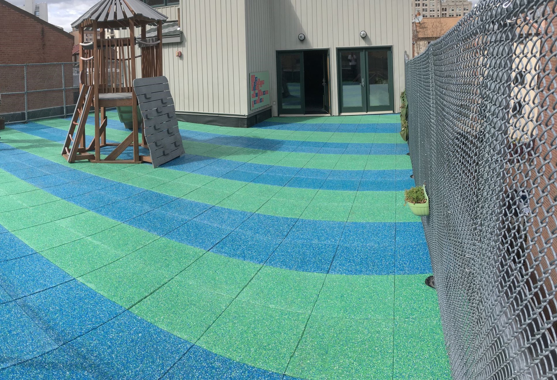 UNITY'S Rooftop Playground Pavers Using Solid TPV Top Color Chips