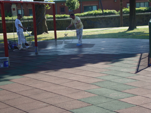 UNITY SURFACING = Showing the painting process of our playground surfacing