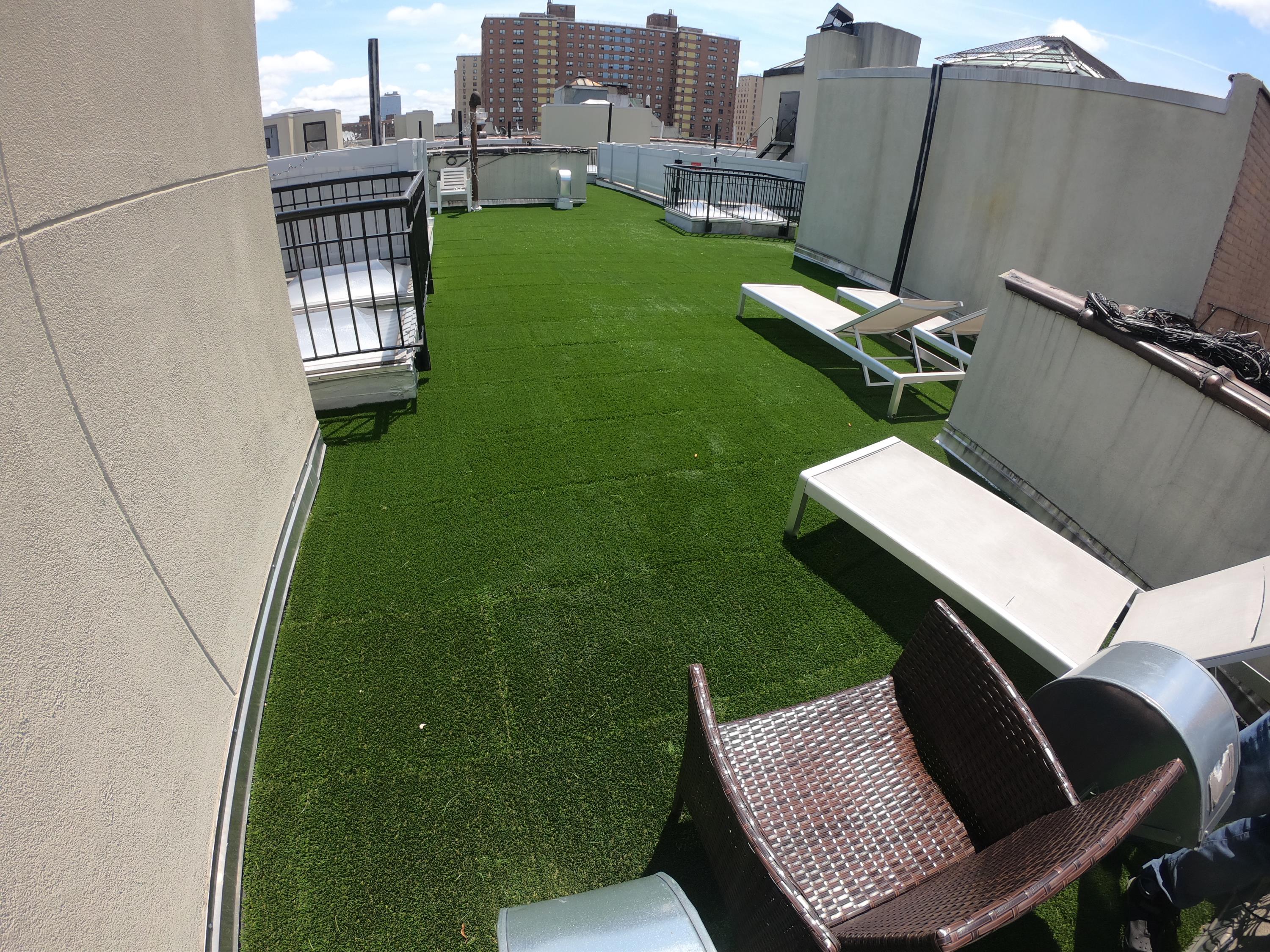 Synthetic Turf Top Tiles on building rooftop for community use.