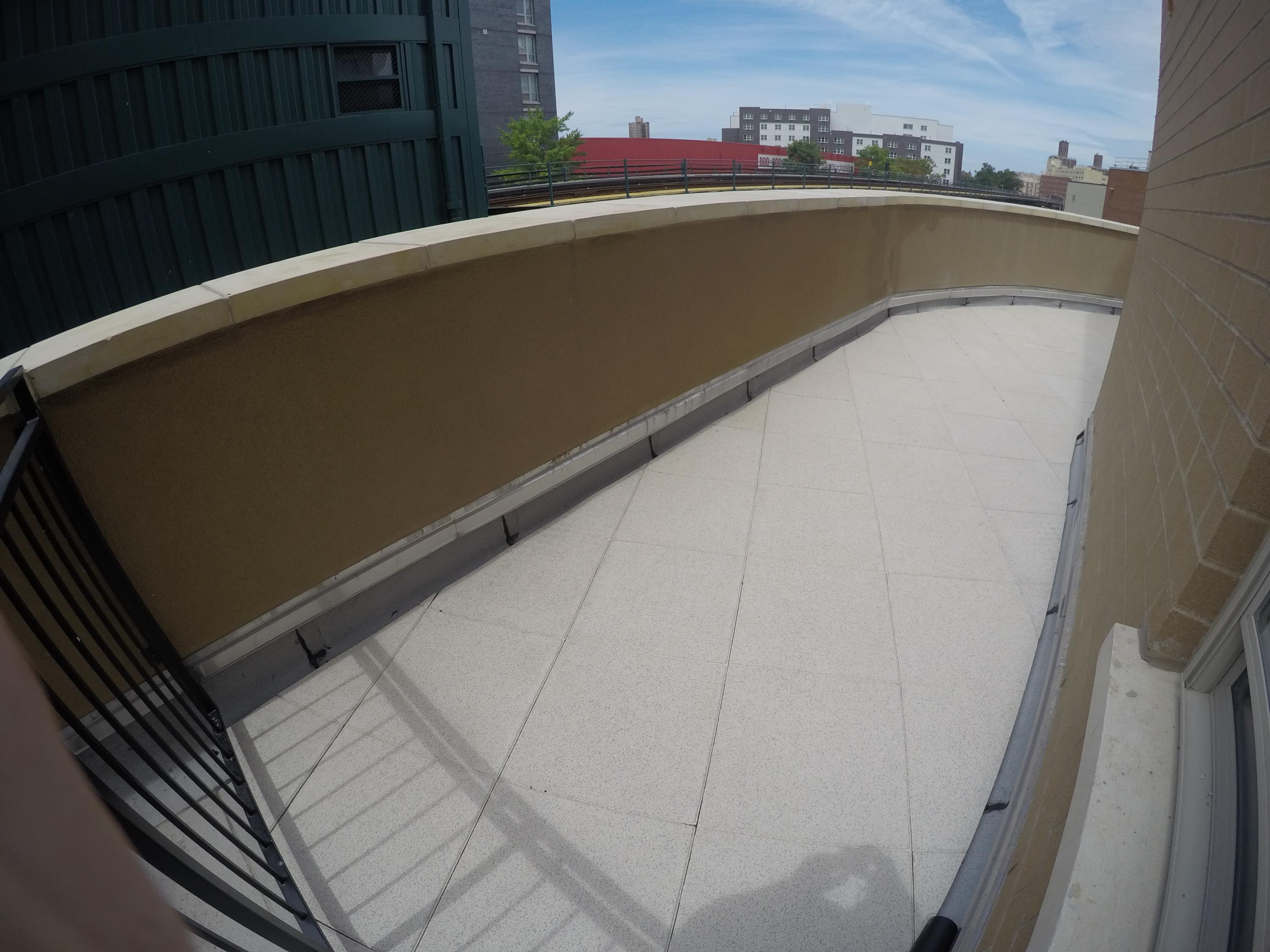 Custom blended rubber pavers for this apartment building rooftop