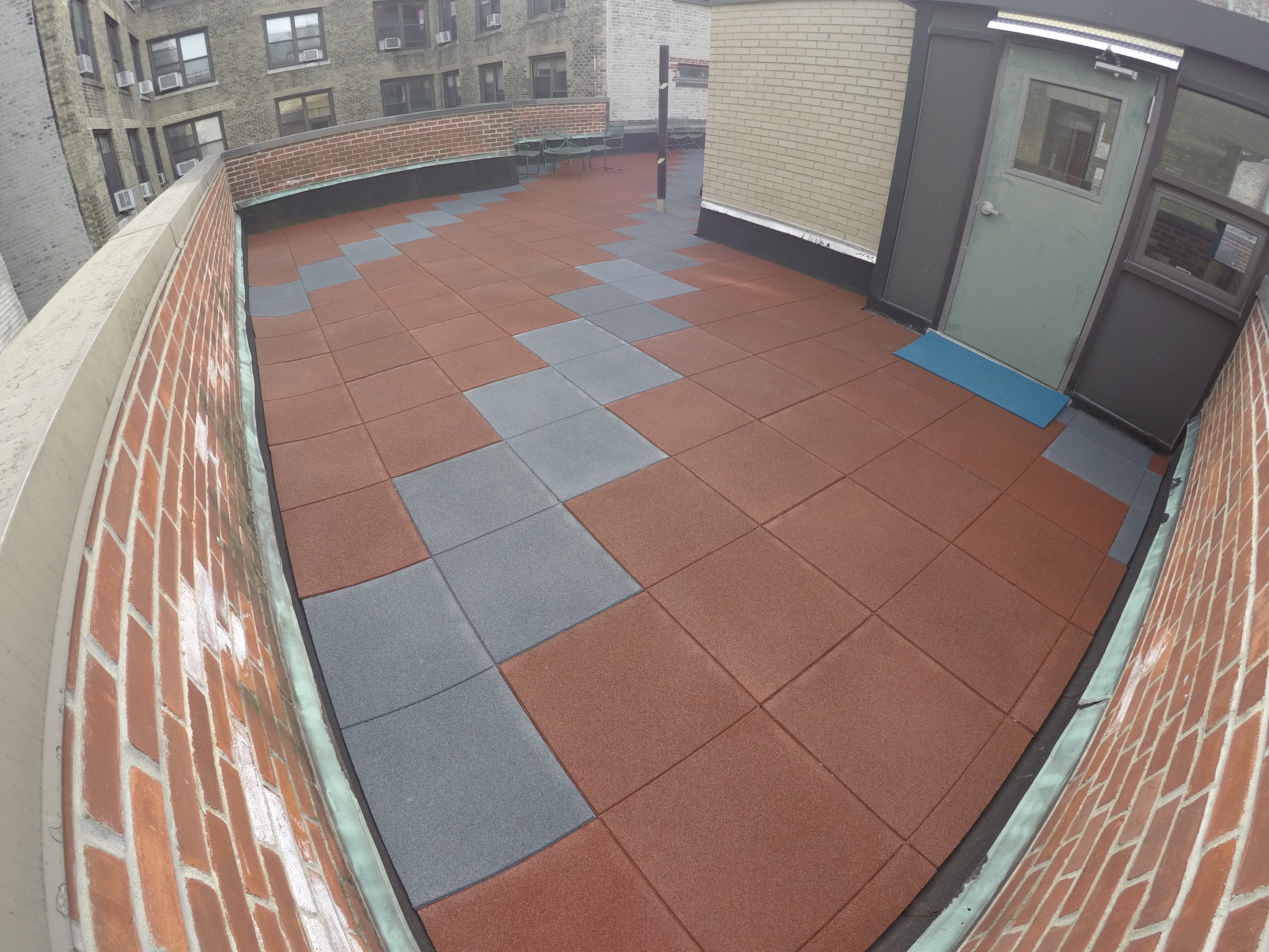 Rooftop play patio area using multiple pigmented colors
